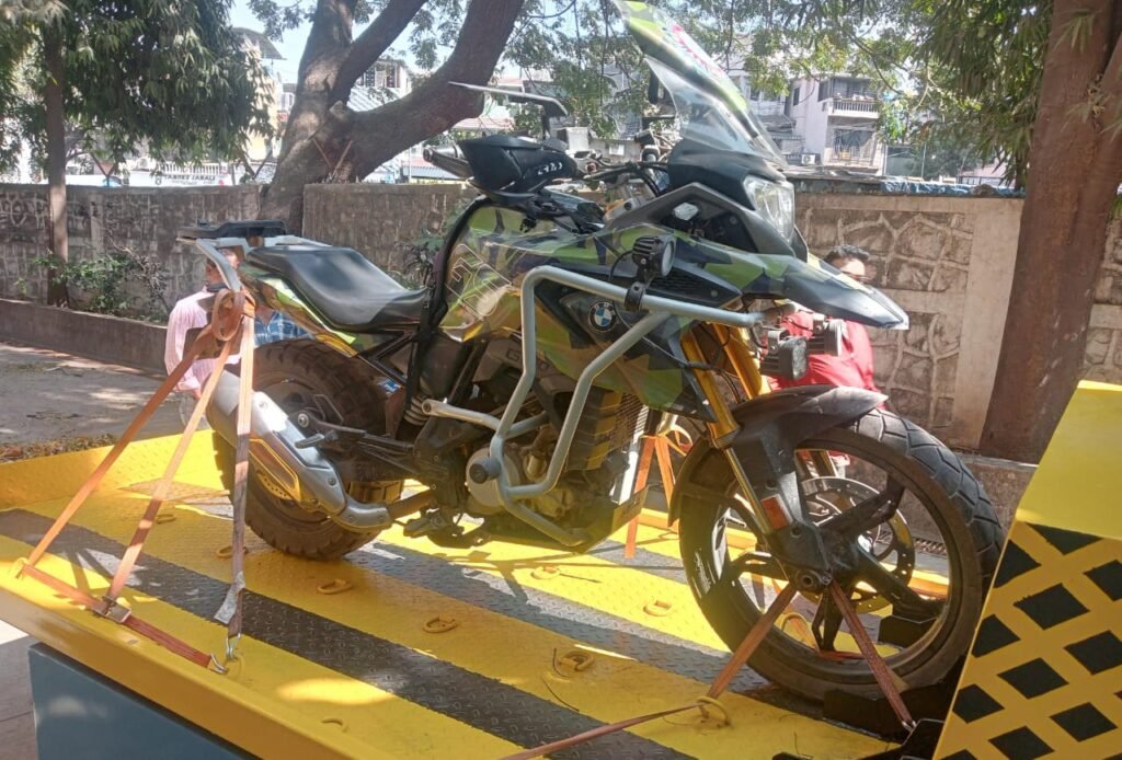 BMW GS adventure motorcycle towed from Chita Camp using a flatbed towing vehicle